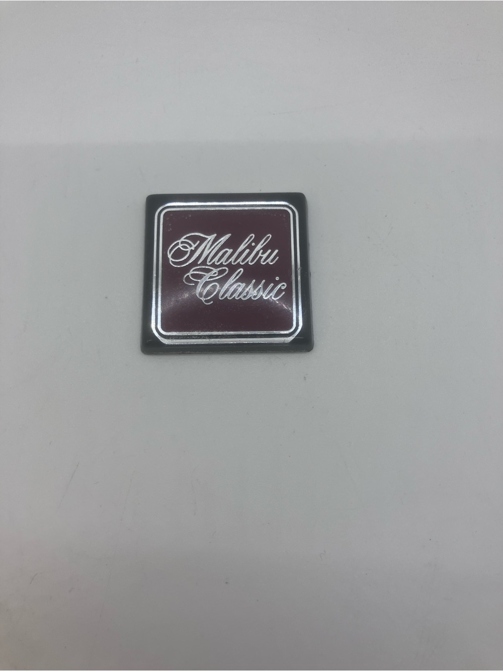 Chevy Malibu Classic Square dashboard emblem Maroon and Silver vintage rare